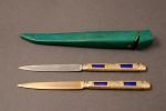 A pair of enamelled and gold knifes