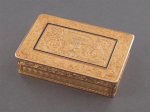 A gold rectangular snuff box