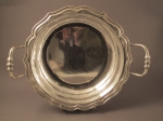 A silver stew service plate