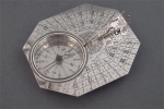 A silver sundial