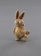 A gem-set gold rabbit brooch